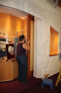 Cynthia Eid installing the handles for the doors of the ark